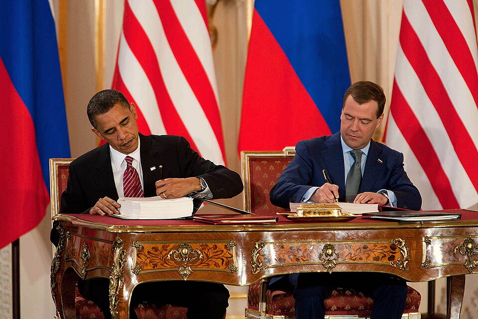 President Obama and President Medvedev sign New START in Prague.
